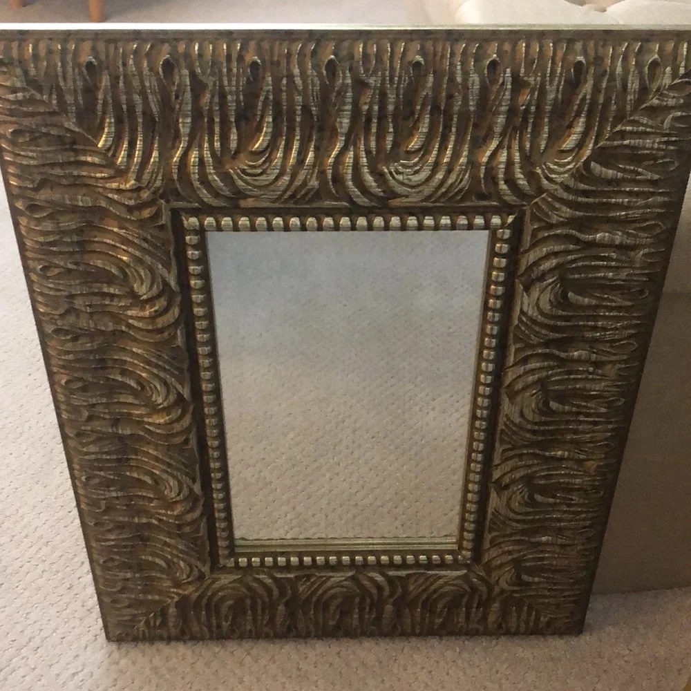 Wood framed mirror in gold